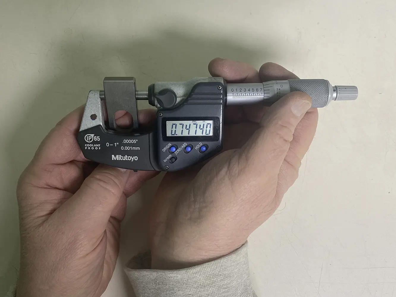 A worker in a production room with stands for manufacturing electric wiring for cars at a modern plant stock photo
