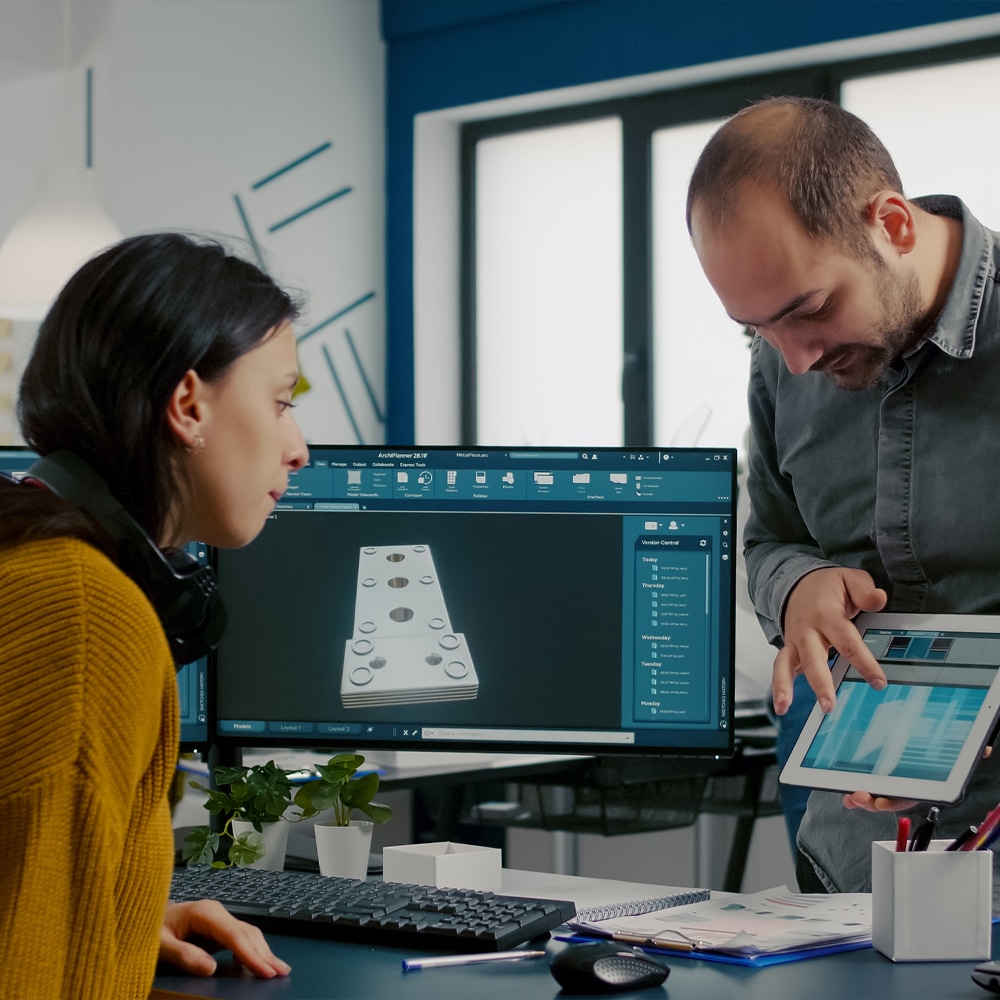 a group of people looking at a computer
